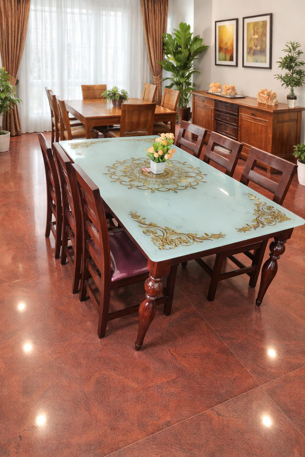 marble top dining table with golden inlaid decorative motifs and wooden legs & chairs.